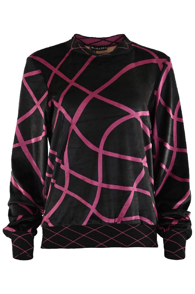 Hedey is een heerlijk zachte velvet trui en bevat lange mouwen. De trui heeft een bogen patroon en op de manchetten en de boord een dun ruiten patroon. Hedey is te verkrijgen in het zwart met roze en in het zwart en cognac.  